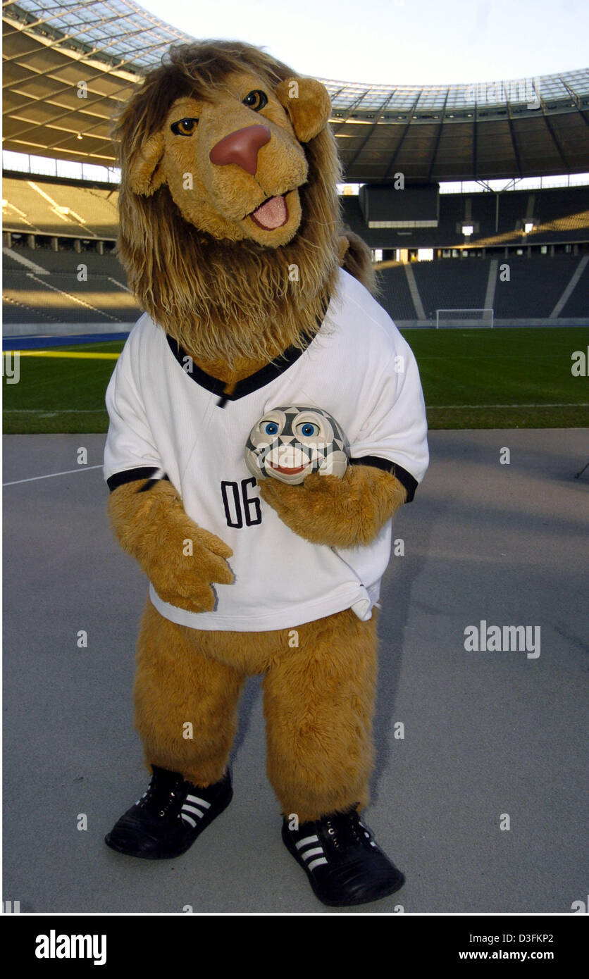 (dpa) - The official mascot of the 2006 FIFA Soccer World Cup, a lion named Goleo, holds the speaking ball named 'Pille' at Olympic Stadium in Berlin, Germany, 16 December 2004. A television crew is in the process of shooting a trailer for German television station ZDF at the designated site of the 2006 World Cup final. Stock Photo