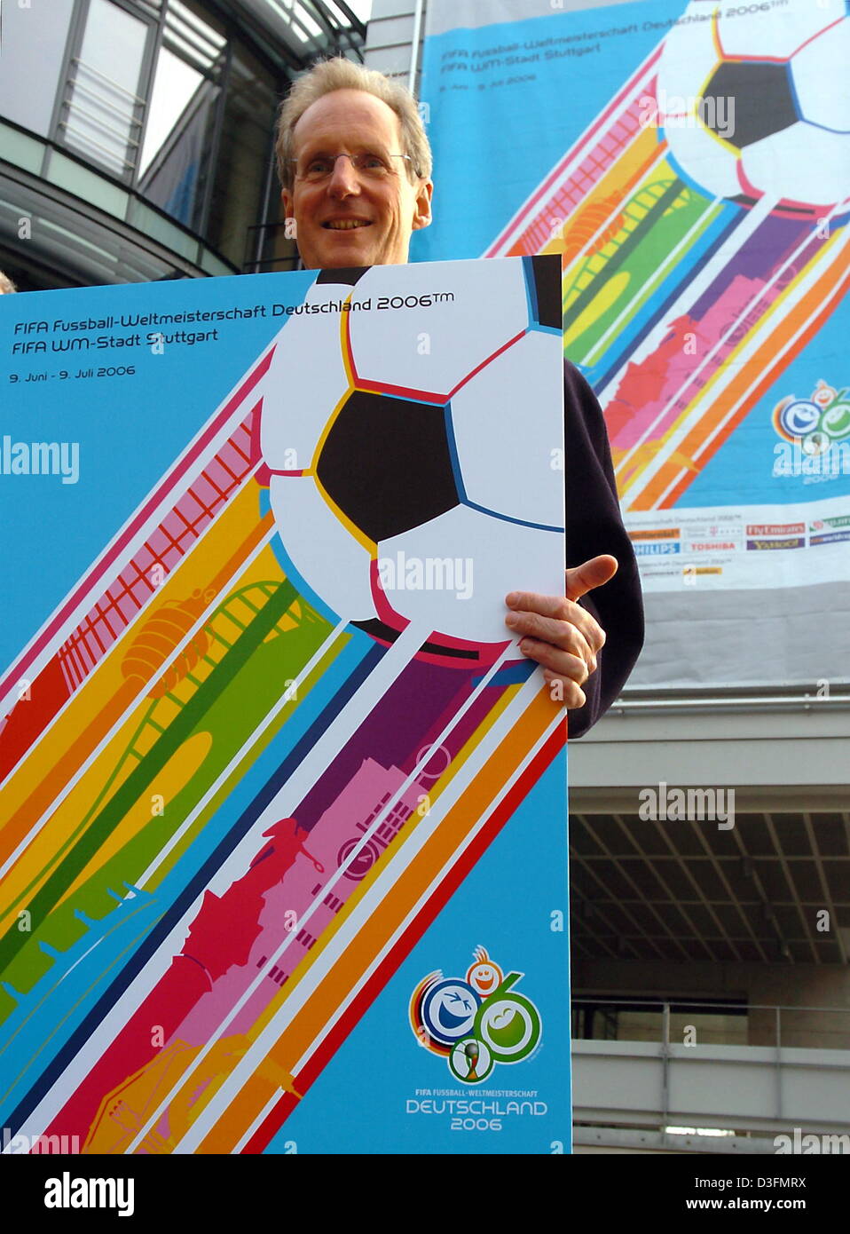 (dpa) - Wolfgang Schuster, Mayor of the German city of Stuttgart, presents Stuttgart's official 2006 FIFA Soccer World Cup poster in front of the Gottlieb Daimler stadium in Stuttgart, Germany, 2 December 2004. Stock Photo