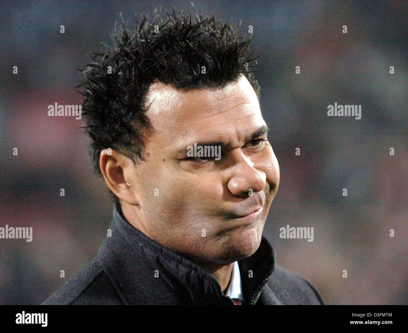 (dpa) - Rotterdam head coach Ruud Gullit makes a face during the UEFA Cup match between Dutch club Feyenoord Rotterdam and German side FC Schalke 04 at De Kuip Stadium in Rotterdam, the Netherlands, 1 December 2004. Rotterdam won the match 2-1 but both clubs managed to qualify for the last 32 of the UEFA Cup. Stock Photo