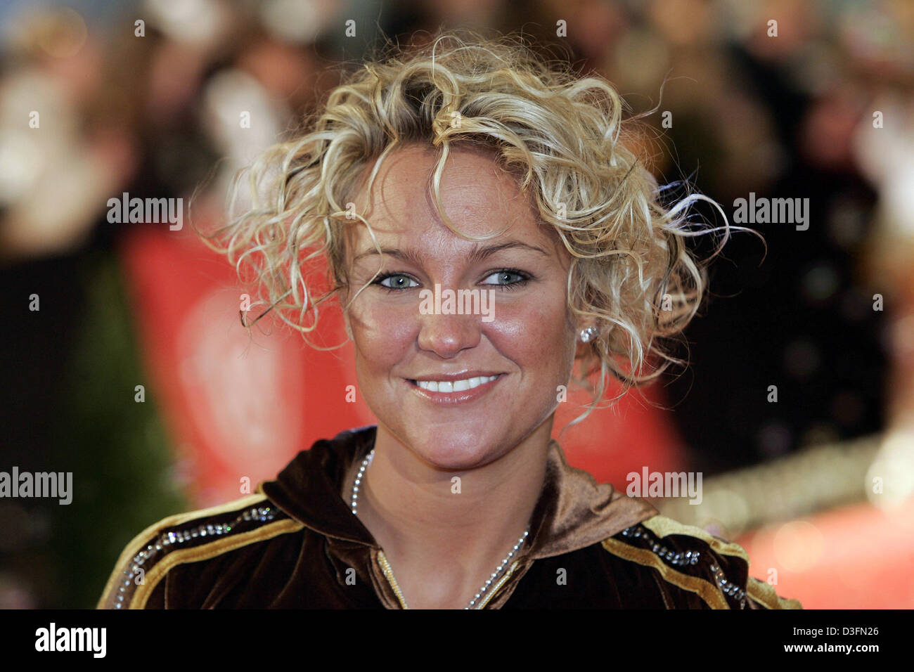 (dpa) - Belgian singer Kate Ryan smiles as she arrives to the 'The Dome 32' event at the TUI Arena in Hanover, Germany, 26 November 2004. Stock Photo