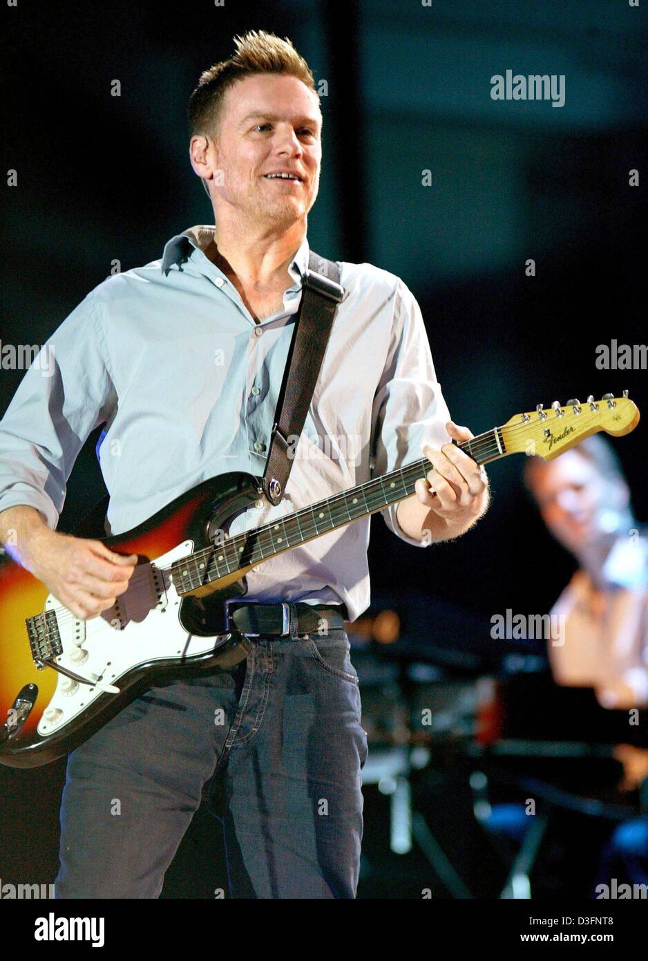 (dpa) - The 43-year-old Canadian singer Bryan Adams performs live on stage during his concert in Magdeburg, Germany, 13 May 2003. Stock Photo