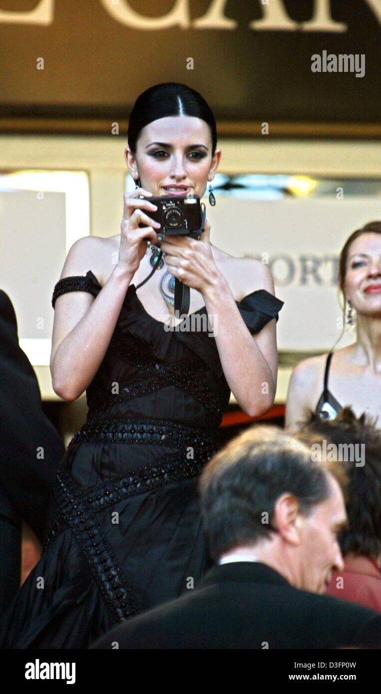(dpa) - Spanish actress Penelope Cruz takes pictures just before the opening gala of the 56th International Filmfestival in Cannes, France, 14 May 2003. The first film which was officially selected by the jury and screened to the audience was the French production 'Fanfan la tulipe'. 20 films are in this year's competition for the Golden Golden Palm Award. Stock Photo