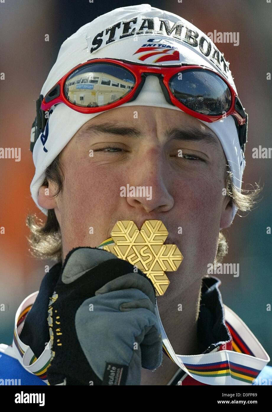 (dpa) - US skier Johnny Spillane kisses his gold medal during the award ceremony of the Nordic Skiing World Championships in Lago di Tesero in Val di Fiemme, Italy, 28 February 2003. He won the nordic combined gold medal in the 7.5km nordic combined sprint event. Stock Photo