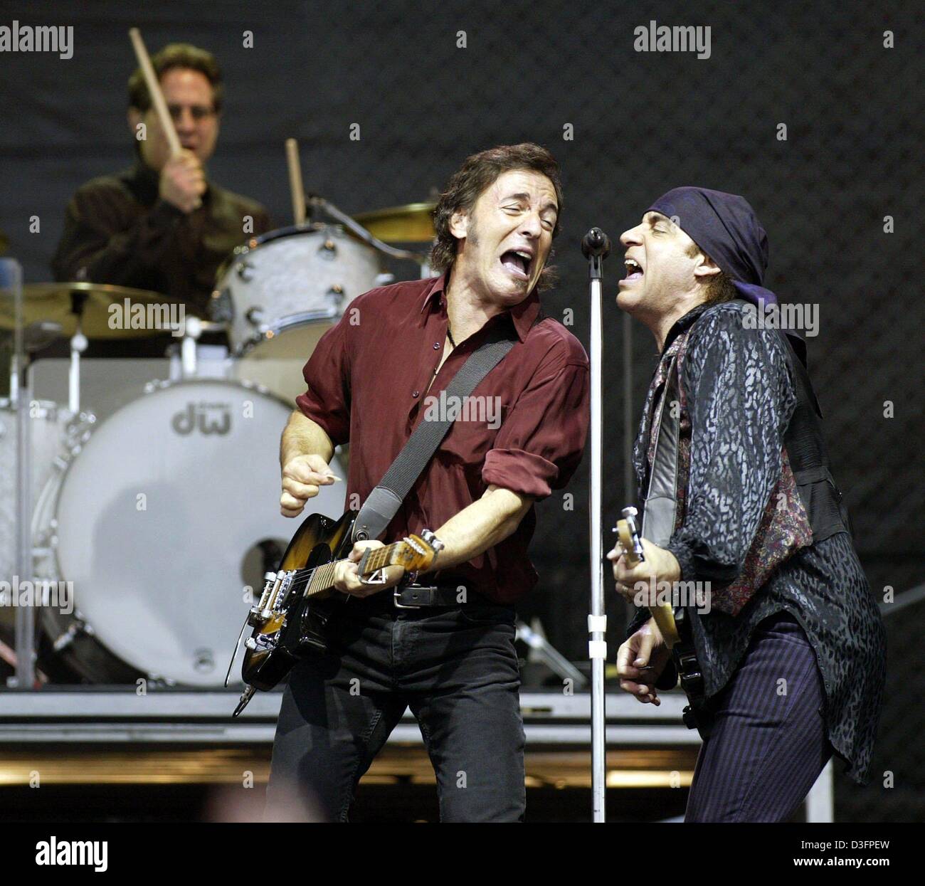 (dpa) - US rock star Bruce Springsteen sings together with Steven van Zandt (R) of the E-Street Band during a concert in Ludwigshafen, Germany, 10 May 2003. 35,000 fans attended the concert of 'The Boss', who played many of his hits, including songs from his latest album 'The Rising', which deals with the terror attacks of 11 September. 'The Rising' is Springsteen's first album of  Stock Photo