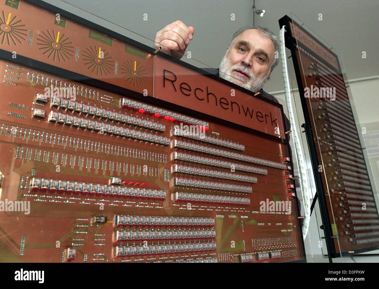 (dpa) - Leopold Stein, a member of the Zuse society, presents a replica of the Z 3, the legendary first calculator of the computer pioneer Konrad Zuse, at the Konrad Zuse museum in Huenfeld, Germany, 3 April 2003. The title on the chip board reads 'Rechenwerk' (calculatory works). The original Z3 computer was presented by Konrad Zuse at his home on 12 May 1941: it was the first pro Stock Photo
