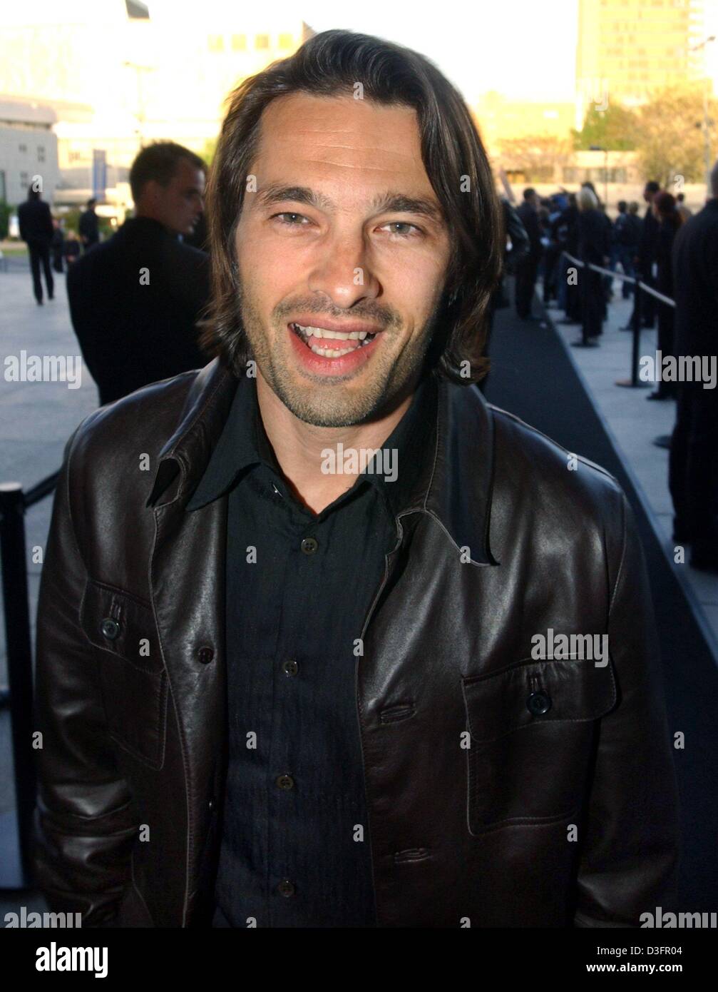 (dpa) - French actor Olivier Martinez arrives at Giorgio Armani's party for the opening of Armani's exhibition in Berlin, 7 May 2003. Martinez is the new face for the Armani spring collection 2003. Stock Photo