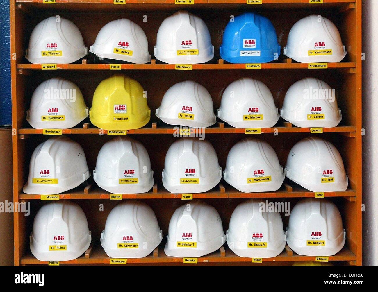 (dpa) The company logo is seen on the hard hats in a shelf at the