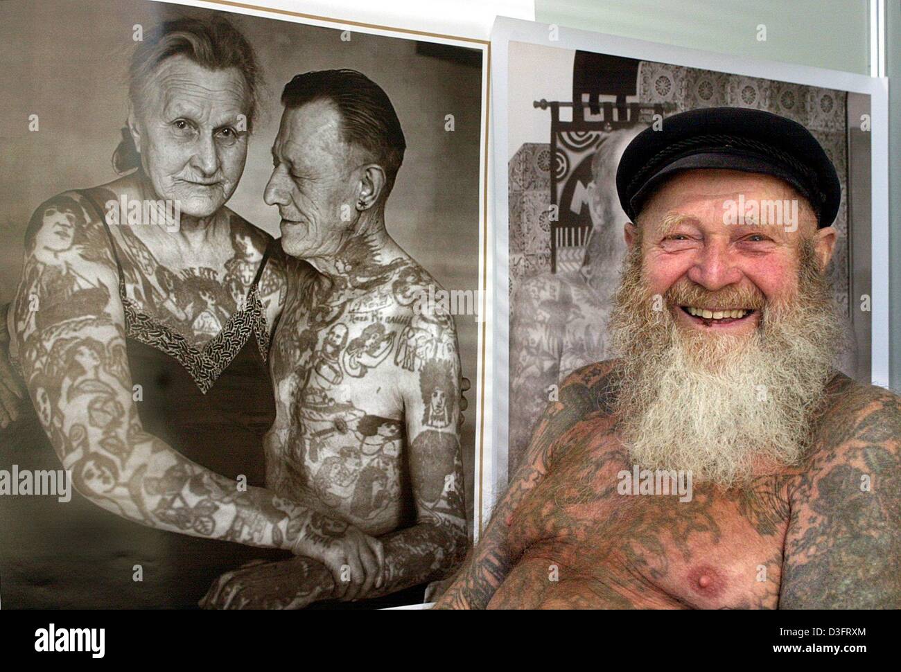 (dpa) - Tattooer Herbert Hoffmann is laughing as he is posing in front ...