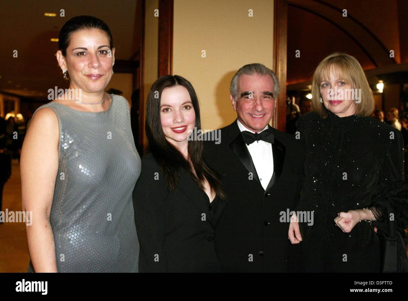 (dpa) - US film director Martin Scorsese poses with his wife Helen (R) and his daughters Julia (L) and Domenica Cameron from a previous marriage, backstage at the Directors Guild of America (DGA) awards show in Los Angeles, 1 March 2003. Scorsese won the DGA Lifetime Achievement Award for distinguished achievement in Motion Picture Direction. Stock Photo