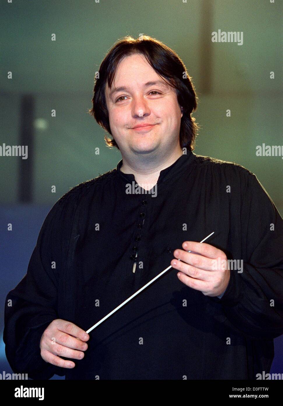 (dpa) - Swiss conductor Stefan Blunier poses with his baton in Berlin, 4 March 2003. The 39-year-old conductor has been general music director of the Staatstheater (state theatre) in Darmstadt, Germany, since the 2001/2002 season and is also collaborating with several orchestras of broadcasting stations. Stock Photo