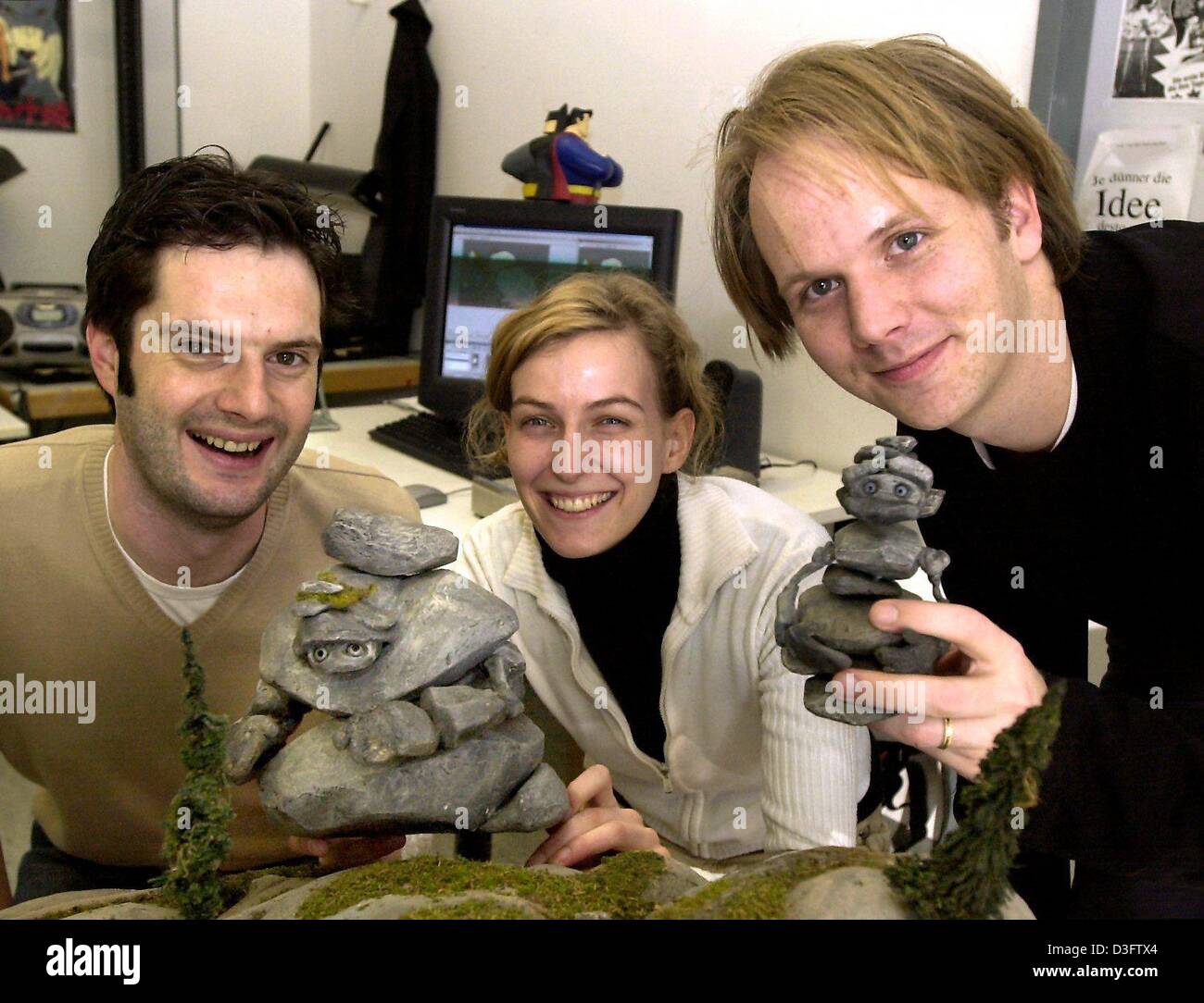 (dpa) - Film producer Georg Gruber (L) and the directors Heidi Wittlinger and Chris Stenner present the 'protagonists' of their animated short film 'Das Rad' (the wheel) at the Filmakademie in Ludwigsburg, Germany, 24 February 2003. Their 9-minutes long film was nominated for the Oscar as Best Animated Short Film. 'Das Rad' was made both with tradtitional stop motion effects as wel Stock Photo
