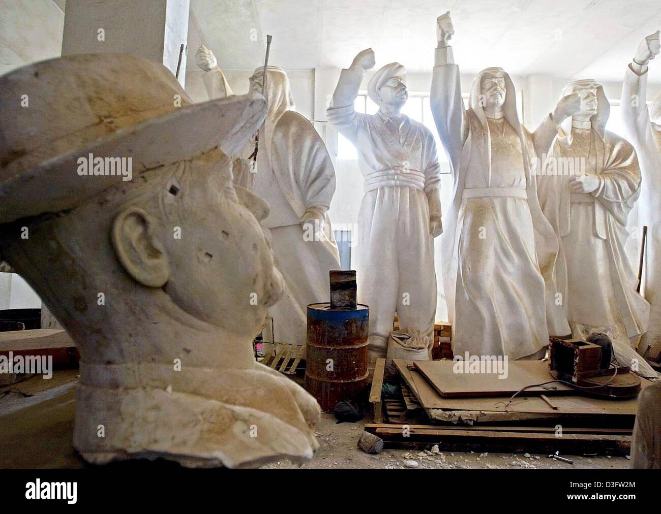 (dpa) - Statues and busts of former Iraqi President Saddam Hussein stand in a factory which produced replicas of the dictator, in Baghdad, 27 April 2003. The whereabouts of Saddam Hussein and his sons after their regime was overthrown remain unknown. Stock Photo