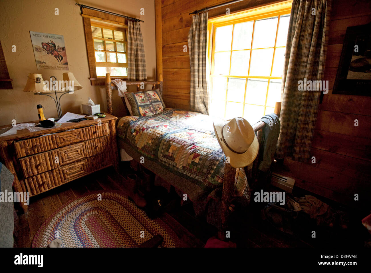 Cowgirls room in log cabin lodge on ranch in Montana, USA Stock Photo