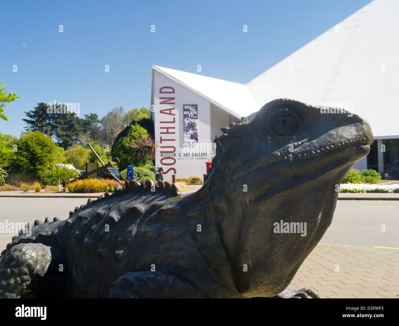 View of the large Tuatara statue in front of Southland Museum, Queens