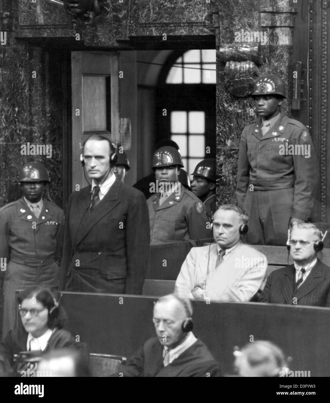 (dpa files) - The industrial magnate Alfried Krupp von Bohlen und Halbach, former sole owner of the Krupp company since 1943, listens to the proclamation of his sentence at the Nuremberg Trials at the court in Nuremberg, Germany, 13 July 1948. He was accused of looting, robbery and slave labour. He was sentenced to 12 years in prison and his wealth and property were confiscated. Af Stock Photo