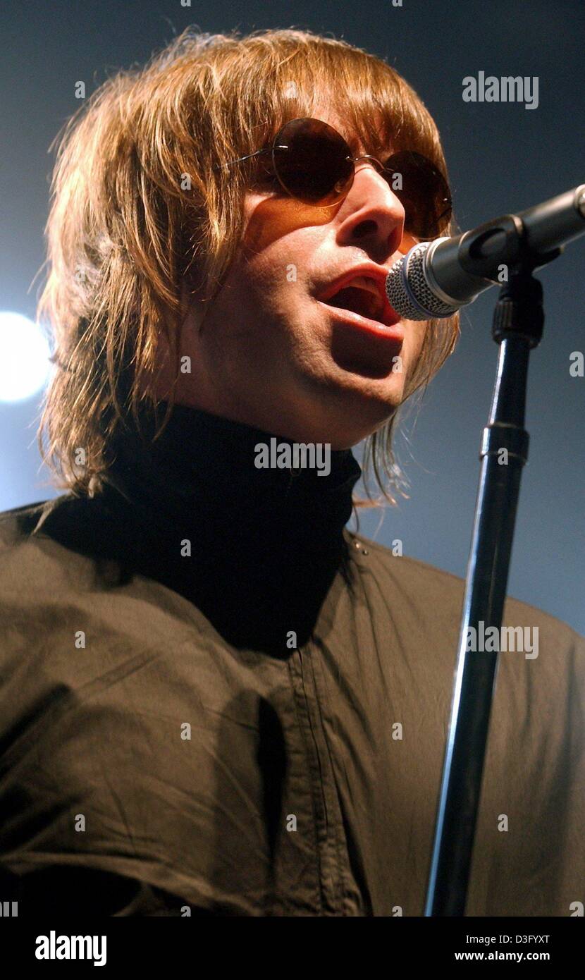(dpa) - Liam Gallagher of the British pop band Oasis performs during a concert in Duesseldorf, Germany, 9 March 2003. After the band had to interrupt their concert tour through Germany last December when Liam lost two teeth in a fight in Munich, the band now continues their tour. Stock Photo