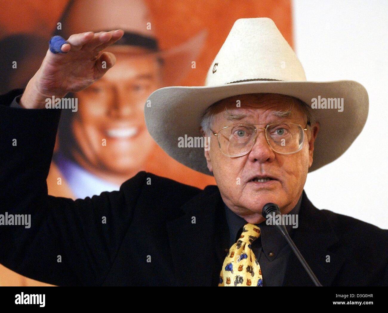 (dpa) - US actor Larry Hagman gestures with his right arm during a promotion for his newly published autobiography in Berlin, Germany, 19 February 2003.  The 71-year-old actor, world famous for his role as 'J. R. Ewing' on the now cult television series 'Dallas', openly addresses his drug and alcohol problems in his book. Stock Photo