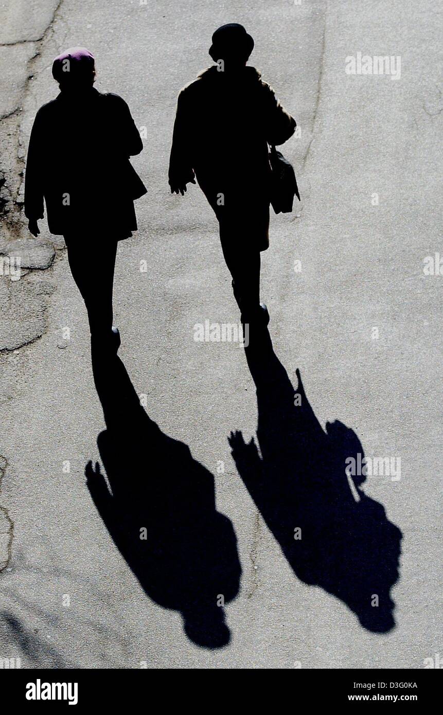 dpa) - Two ladies stroll along a street with their shadows following close  behind in Mainz, Germany, 20 February 2003 Stock Photo - Alamy