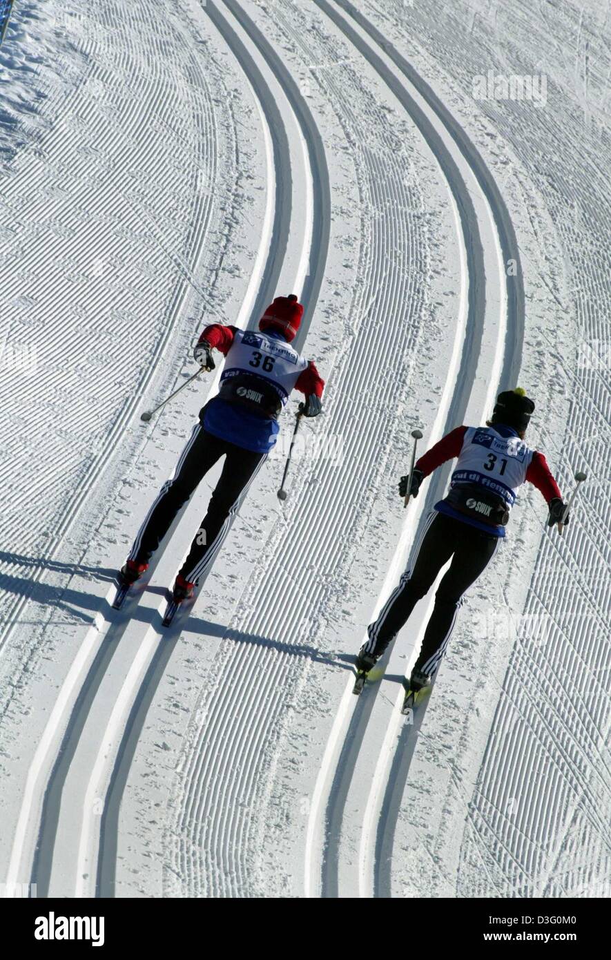(dpa) - Two cross-country skiers train in preparation for the Nordic Skiing World Championship in Val di Fiemme, Italy 17 February 2003. The women's classic style 15 kilometer race is the first competition to take place. The world championship lasts from 18 February until 1 March 2003. Stock Photo