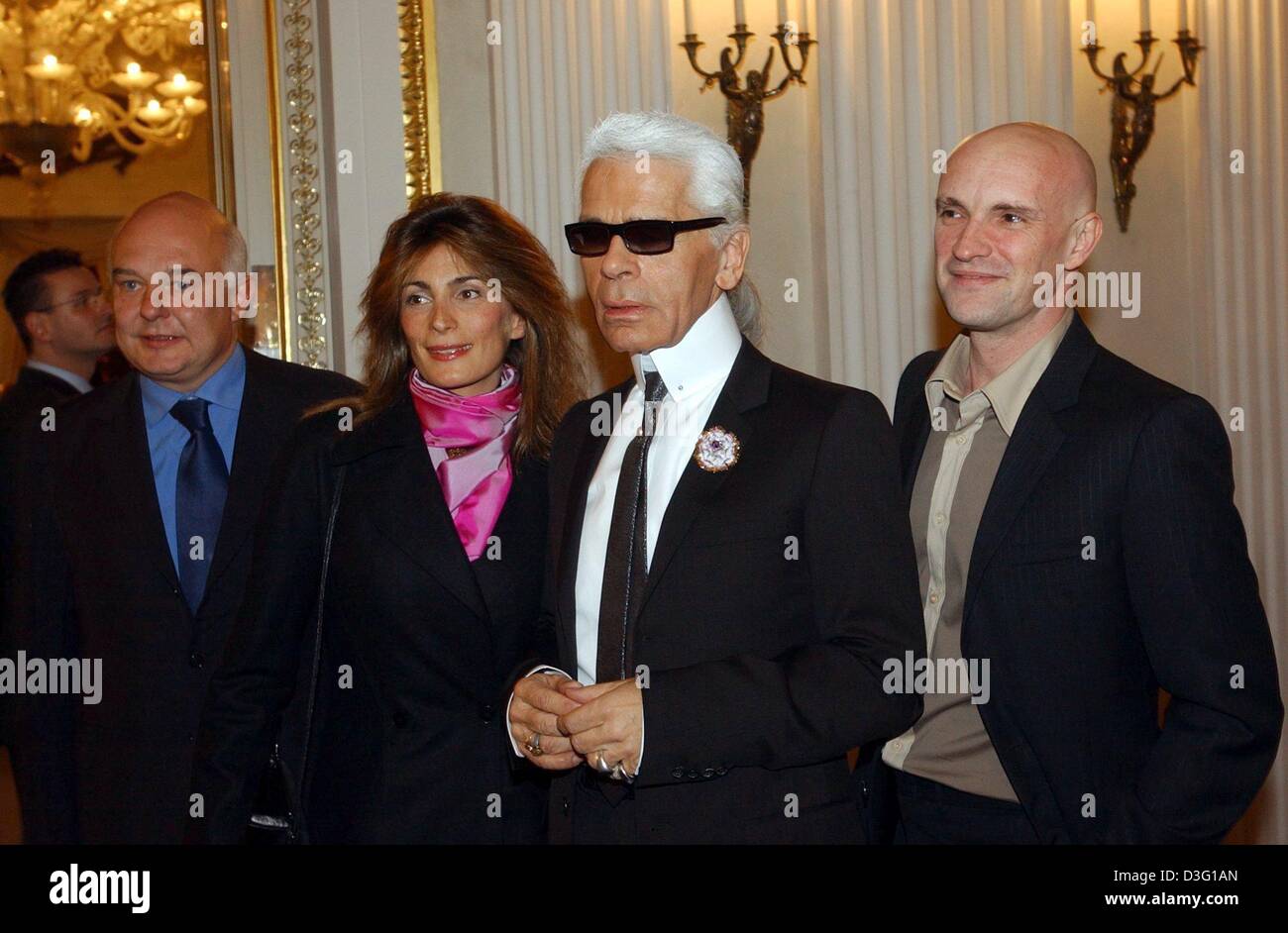 (dpa) - From L: Rolf Sachs, the eldest son of ex-playboy Gunter Sachs, his wife Maryam, fashion designer Karl Lagerfeld and choreographer Jean-Christophe Maillot stand in the National Theatre in Munich, 25 March 2003. At the theatre, the ballet week was opened with a performance of the ballet group 'Les Ballets de Monte Carlo'. Stock Photo