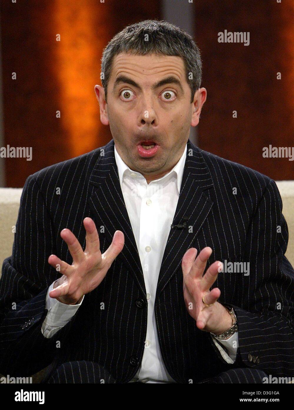 (dpa) - British comedian Rowan Atkinson alias 'Mr Bean' pulls a face during the popular TV show 'Wetten dass...?' (bet that...?), in Lucerne, Switzerland, 22 March 2003. The live show broadcast by the German TV station ZDF was watched by 13.8 million people, although it was subject to be cancelled at the last minute due to the war in Iraq. Stock Photo