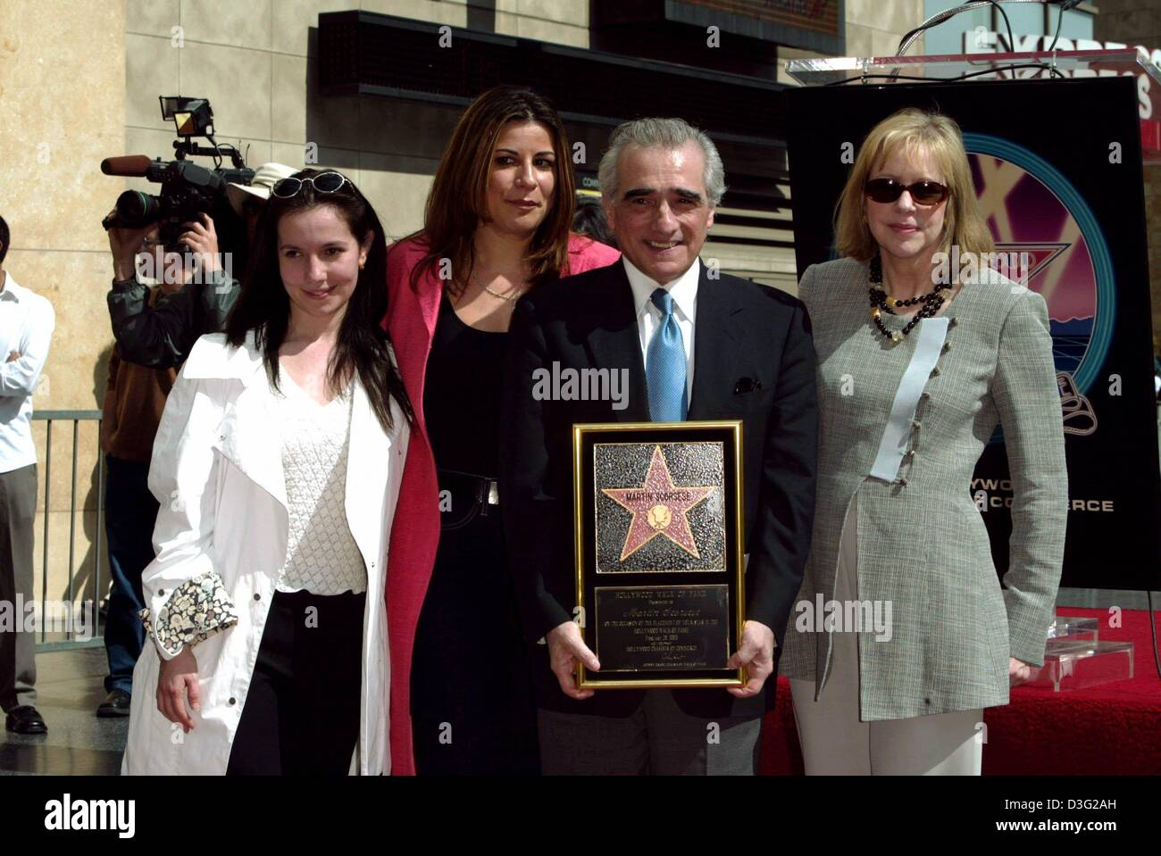 (dpa) - US film director Martin Scorsese poses with his wife Helen (R) and his daughters Domenica (L) and Julia Cameron from a previous marriage as he holds up his star on the Walk of Fame in Hollywood, 28 February 2003. Stock Photo