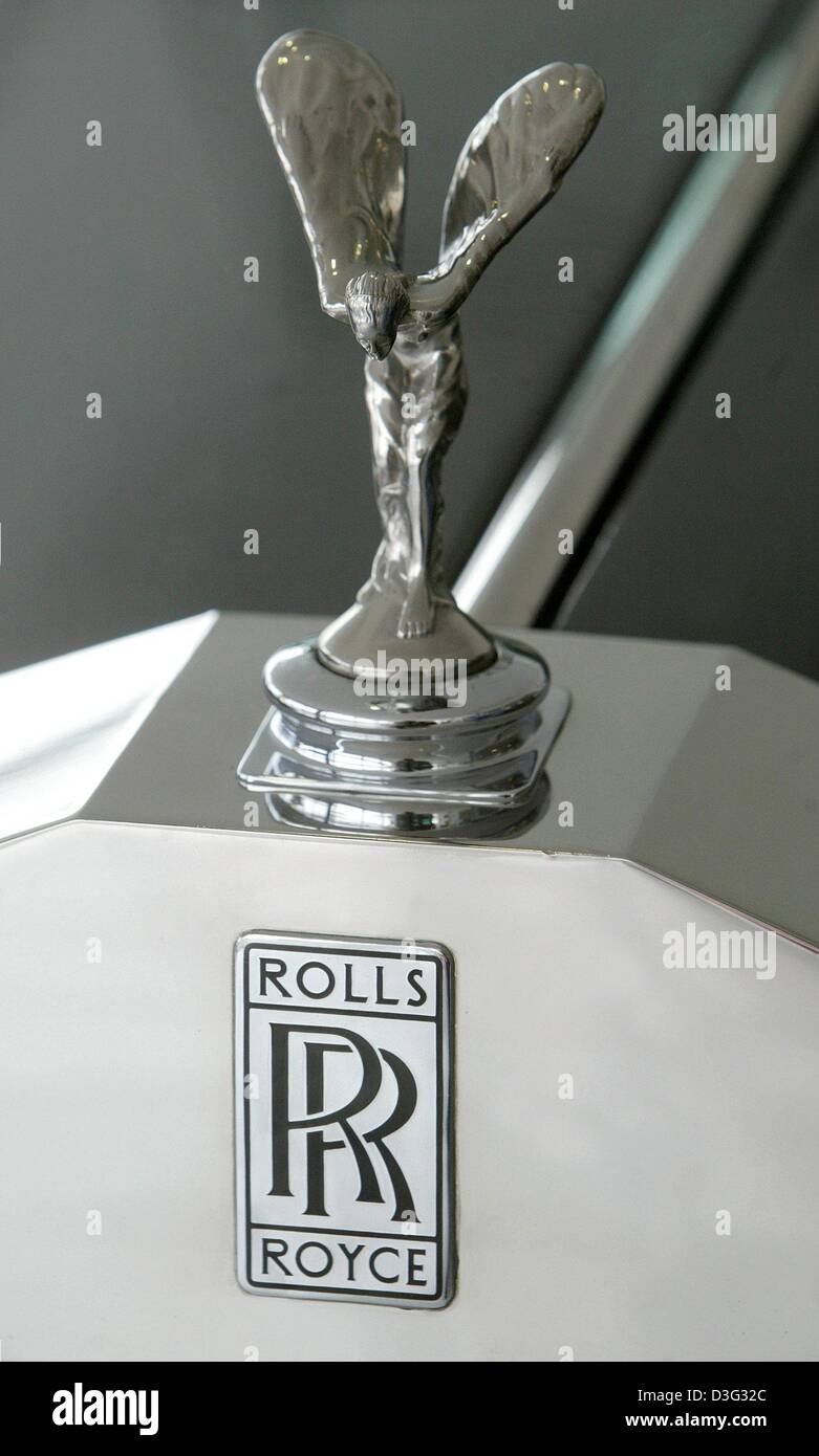 (dpa) - The hood ornament of a Rolls Royce car is photographed at a car dealer's in Magdeburg, Germany, 28 February 2003. The British engine manufacturer Rolls Royce announced to cut employment by 1.100 in Great Britain. The latest job cuts come after 3,800 job losses in October 2001. The modern Rolls Royce plc company has had no direct involvement with the famous motor cars for ab Stock Photo