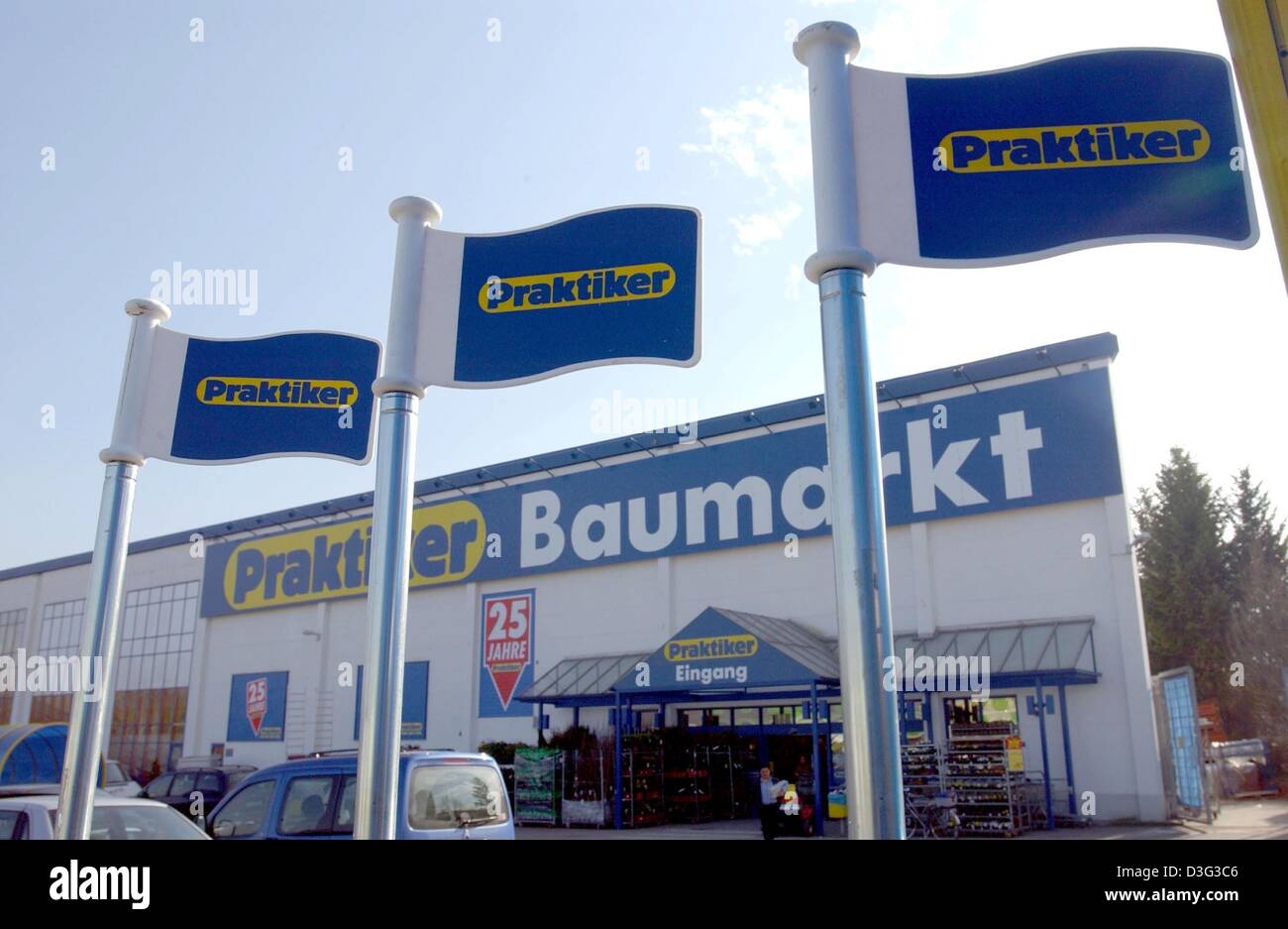 (dpa) - Flags with the company logo of the German DIY store Praktiker fly in front of a store in Cologne, 26 February 2003. Praktiker is a subsidiary company of METRO. After suffering losses Metro might now sell the DIY store chain. Stock Photo