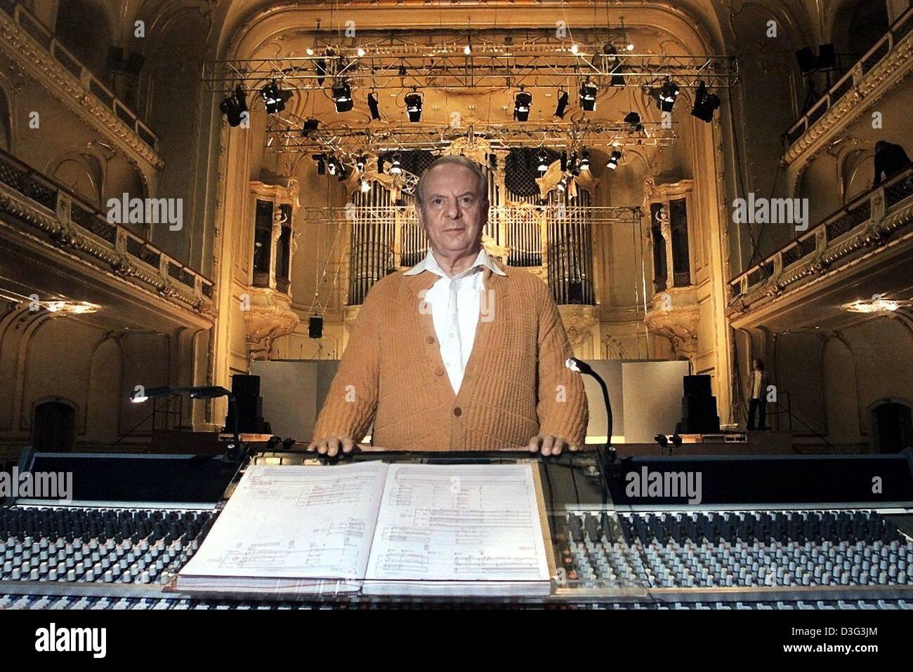 (dpa files) - German composer and avant-garde musician Karlheinz Stockhausen stands at his mixer with the musical directions in front of him and the stage in the background during a Music Festival at the concert hall in Hamburg, Germany, 17 September 2001. A progressive composer Karlheinz Stockhausen has consistently ventured into unknown musical territory. He was fascinated by the Stock Photo