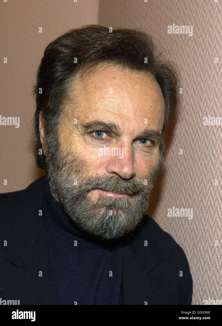 (dpa) - Italian actor Franco Nero pictured in Hamburg, 21 February 2003. He came to Hamburg to promote his latest film, the crime movie entitled 'Die Achte Todsuende - Toskana-Karussell' (the eighth deadly sin - Tuscany merry-go-round). Nero became famous as 'Django' in a series of spaghetti western and starred in films such as 'Camelot', 'Force 10 from Navarone' and 'Die Hard 2'. Stock Photo