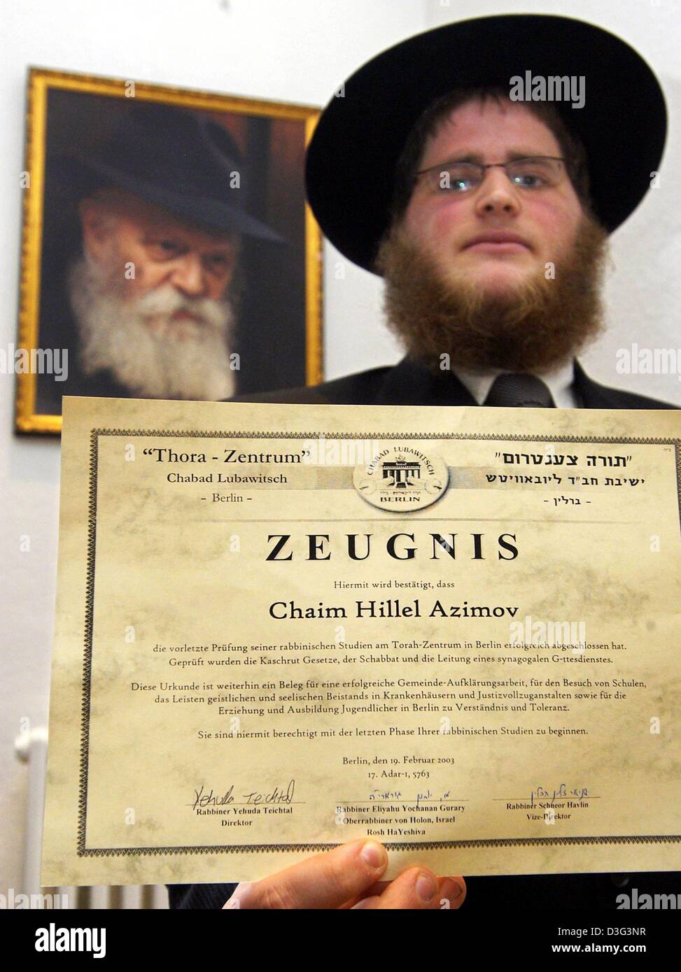 (dpa) - Rabbi student Chaim Hillel Azimov from Jerusalem shows his graduation certificate (Zeugnis) at the 'Chabad Lubavitsh' Jewish Center in Berlin, 19 February 2003. He is one of the ten first rabbi graduates after World War II in Berlin. The organisation 'Chabad Lubavitsh' was founded 150 years ago and is present in Berlin since 1996. Stock Photo