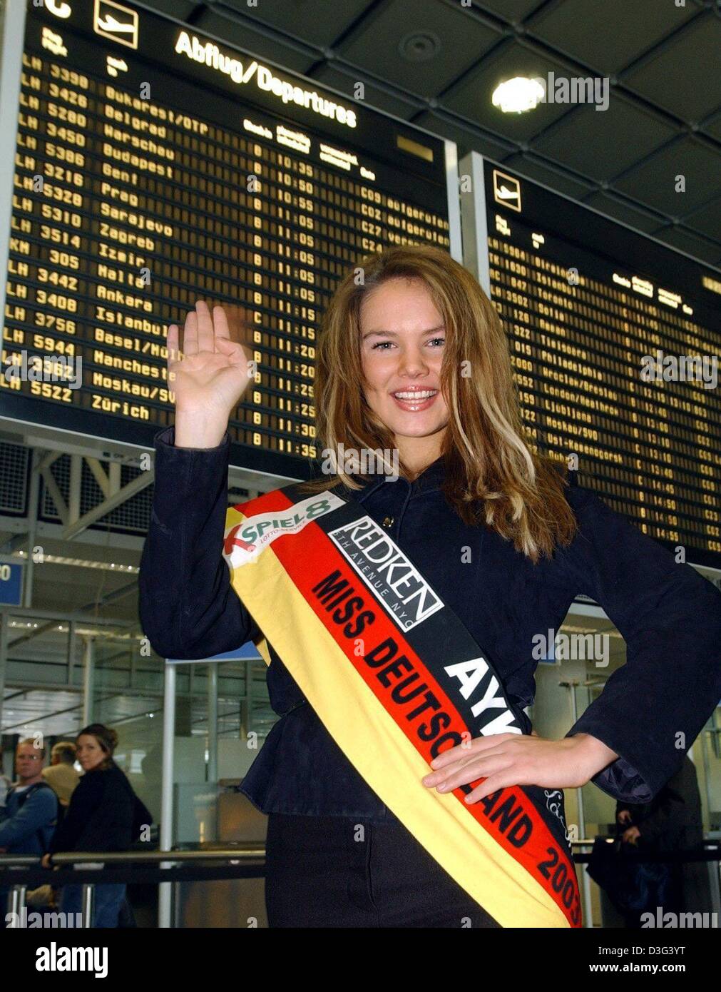 (dpa) - Alexandra Vodjanikova, the current 'Miss Germany', is posing in front of an annunciator panel at Munich airport, 19 February 2003. The 19-year-old is going to Baghdad on a peace mission. Her manager Oswald informed that a meeting with Saddam Hussein is part of her itinerary. Stock Photo