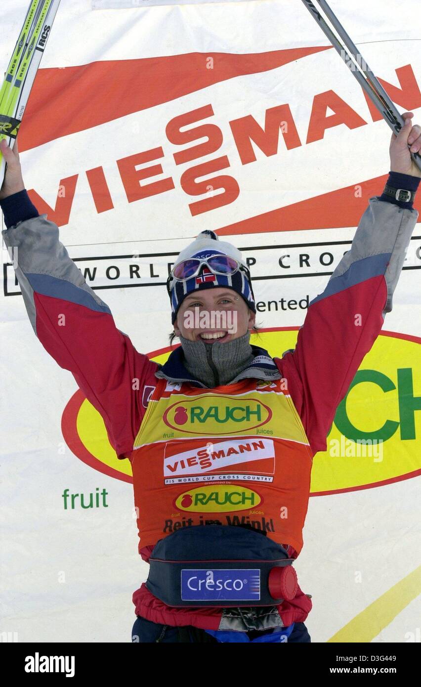 (dpa) - Norwegian skier Marit Bjoergen celebrates during the award ceremony of the women's Nordic Skiing Sprint World Cup in Reit im Winkel, Germany, 12 February 2003. She won first place in the event. Stock Photo