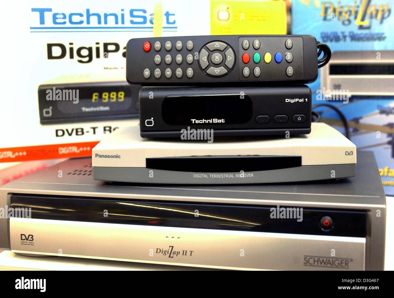 dpa) - Various decoders for digital television (Digital Video Broadcasting  Terrestrial, DVB-T) are piled on the shelves of the electronics store  Medi-Max in Frankfurt Oder, eastern Germany, 3 February 2003. Ten percent