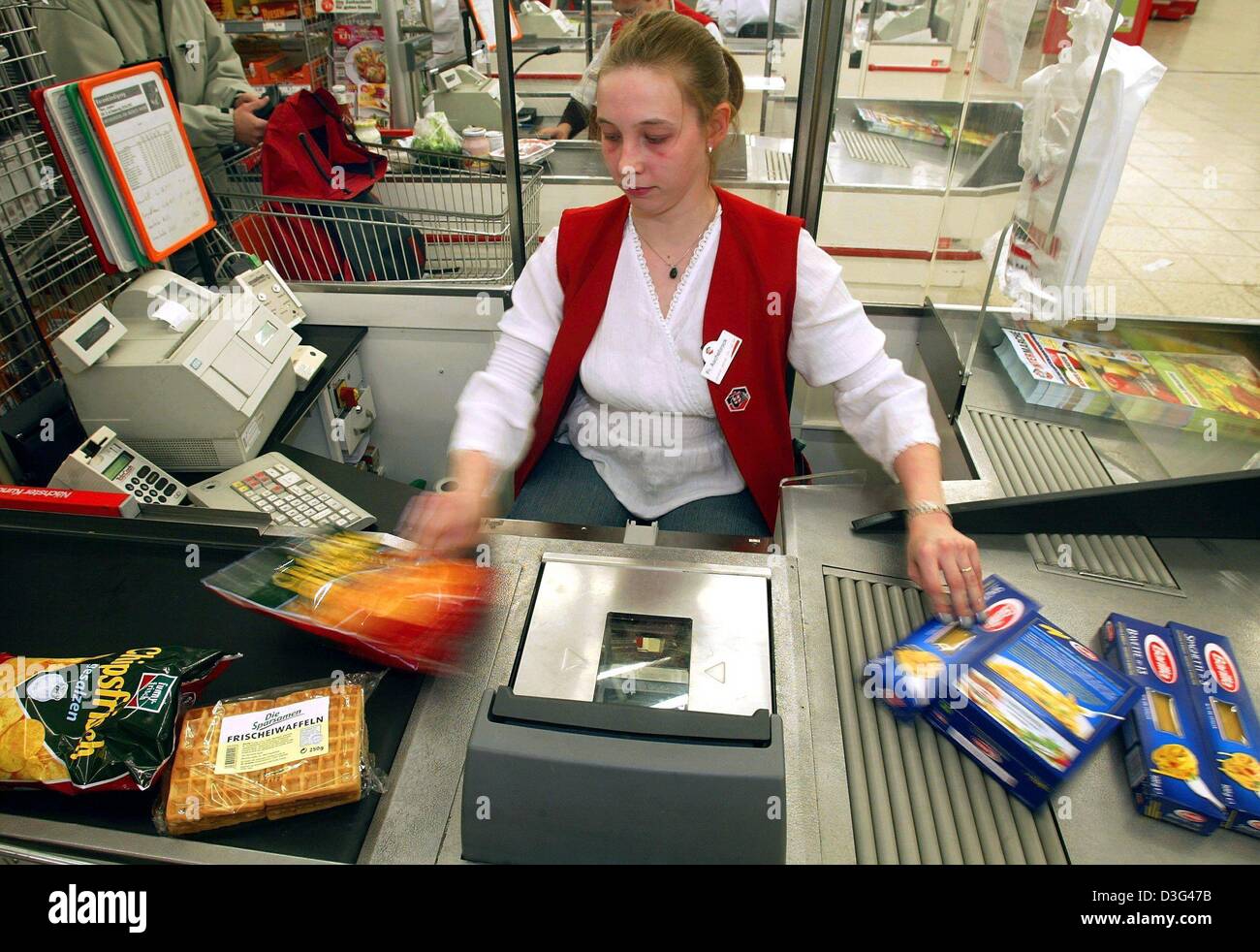 Dpa A Cashier Scans The Prices At A Cash Desk In An Intermarche