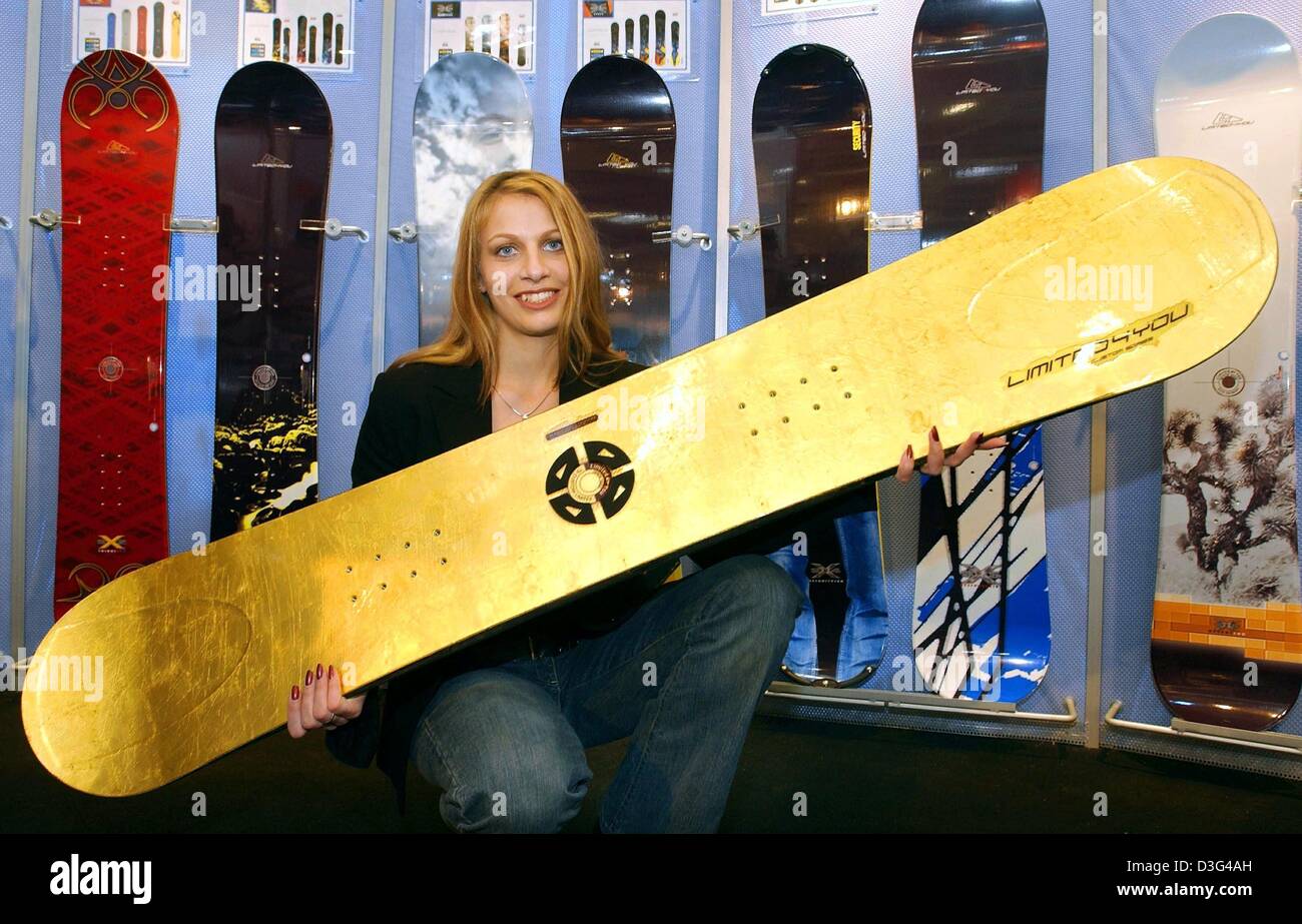 dpa) - Tanja of Prima Limited-4-You presents a fully functional snowboard  coated with 24 carat gold at the International Trade Fair for Sports  Equipment and Fashion (Ispo) in Munich, Germany, 1 February