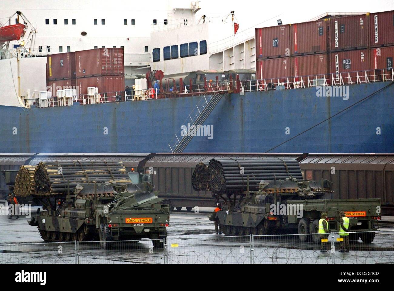 (dpa) - British tanks wait to be loaded onto a cargo ship at the harbour in Emden, Germany, 2 February 2003. These tanks belong to the British military equipment stationed in Germany. It is sent for precautionary reasons to the Gulf region in the context of the conflict with Iraq. Stock Photo
