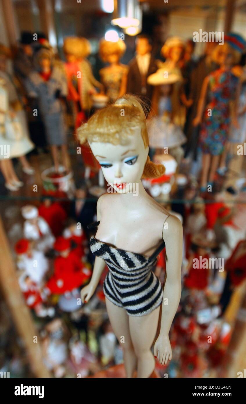 dpa) - A coquettish Barbie doll dressed in a skimpy zebra-print outfit is  photographed in front of a large collection of Barbie dolls in Duesseldorf,  Germany, 30 January 2003. This is one