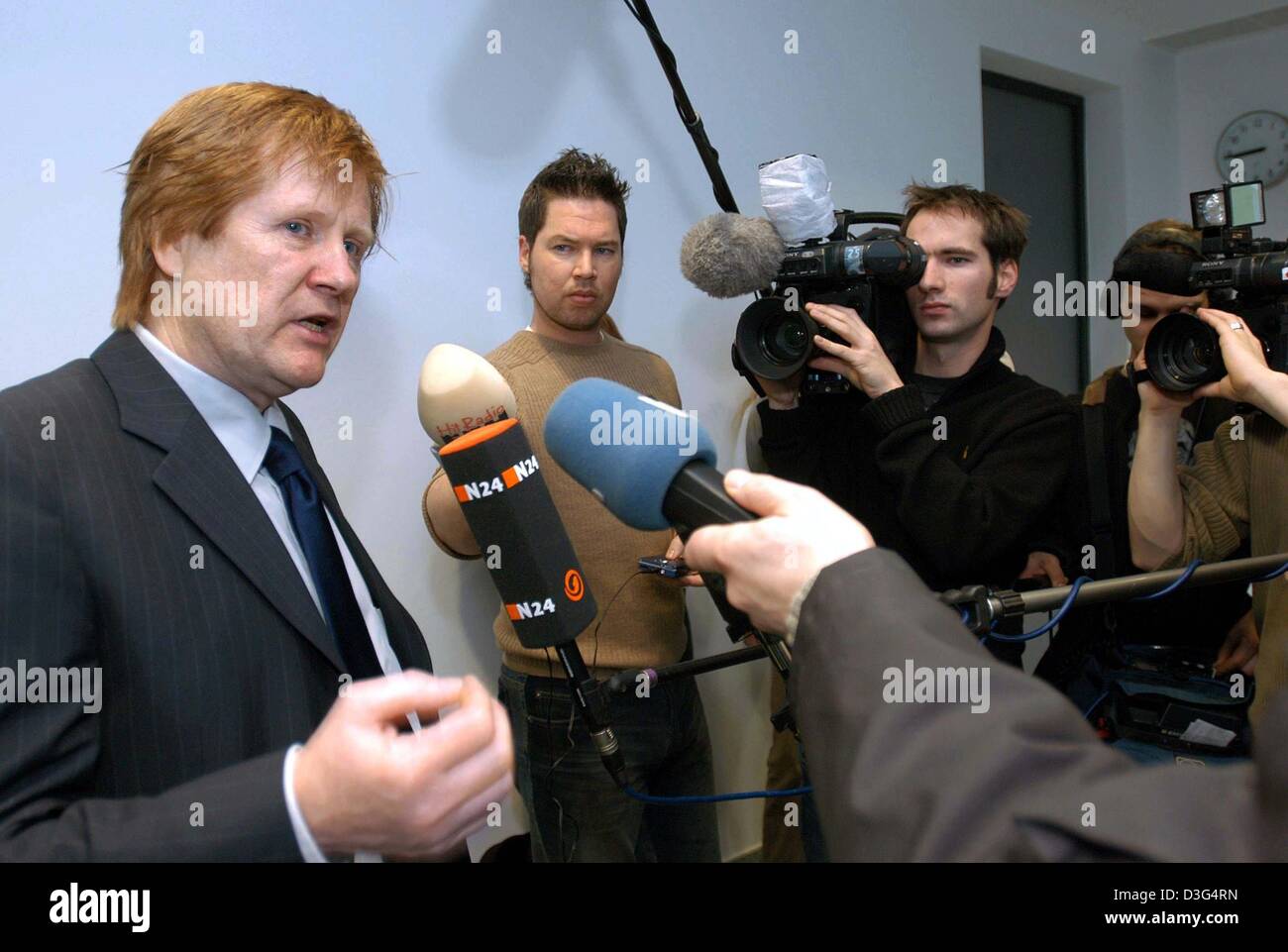 (dpa) - Harald Ermel, the defense attorney of the self-declared cannibal Armin Meiwes gives interviews at the district court in Kassel, Germany, 12 December 2003. The German murder trial of the 42-year-old German computer specialist Armin Meiwes will hear evidence on 12 December of the effects of alcohol and medication on his victim. A toxicologist will give testimony on the third  Stock Photo