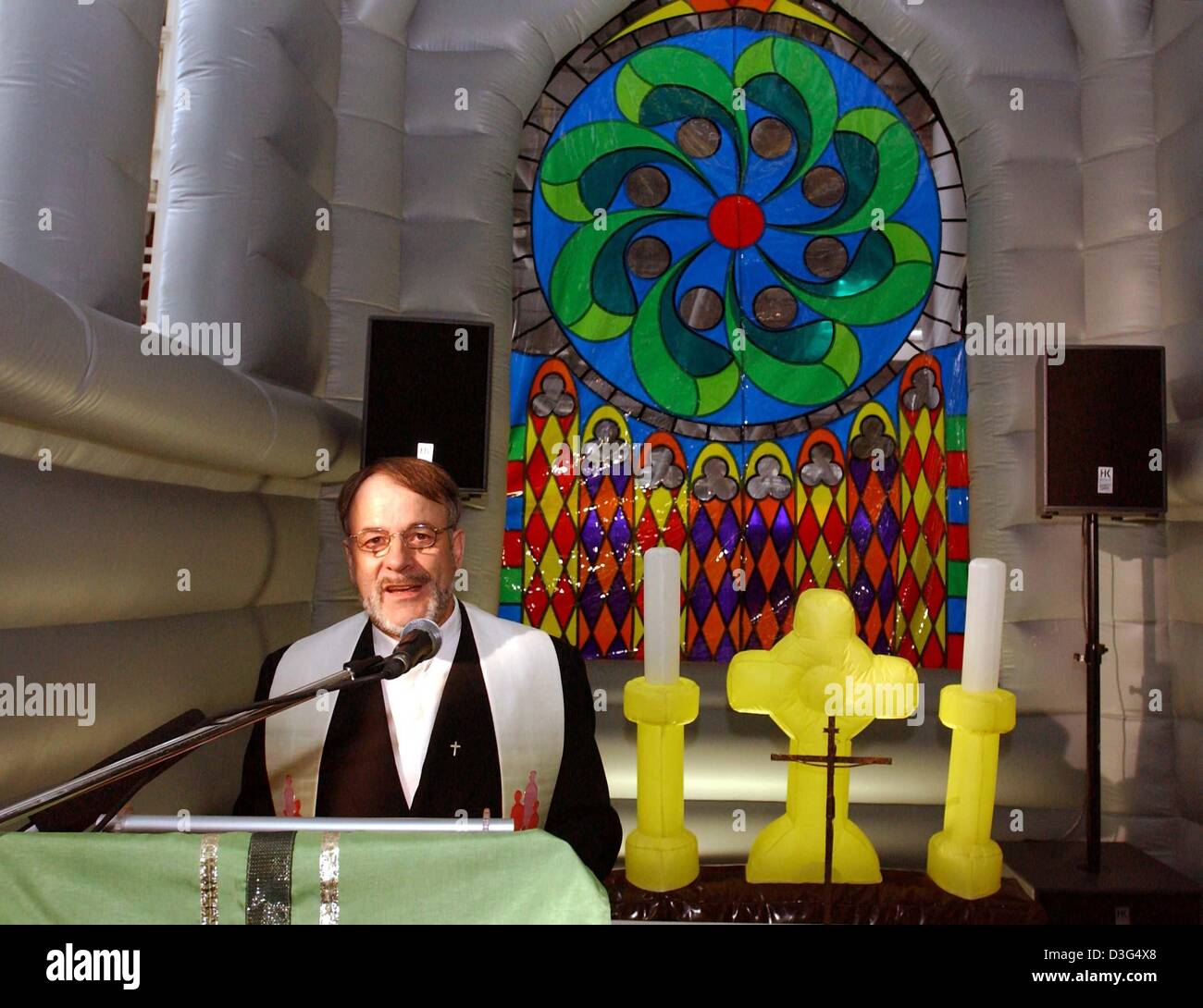 Father Rapp Image (dpa) - Airport priest Otto Rapp holds a service in an inflatable ...