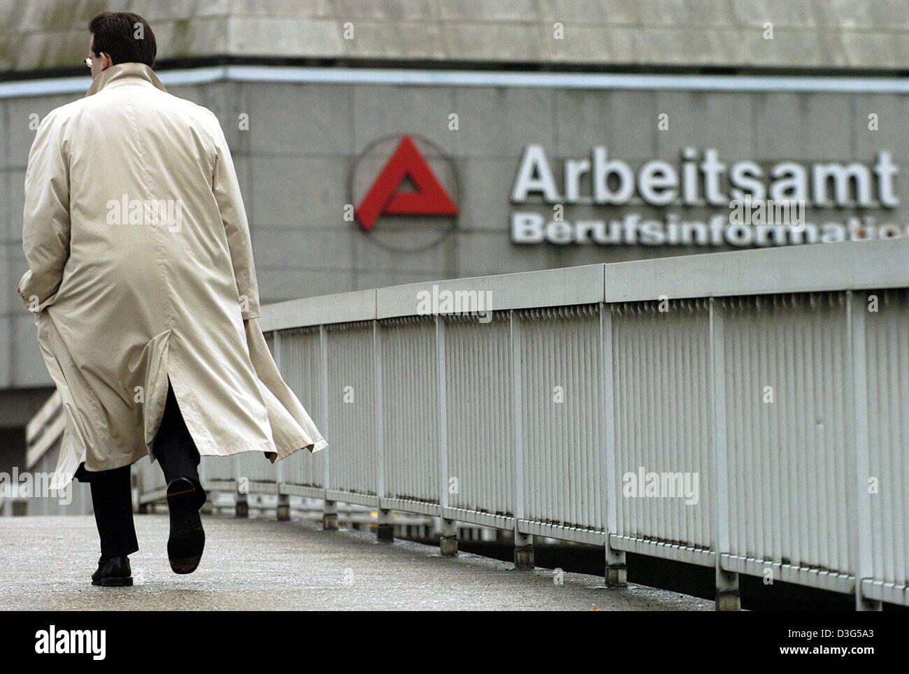 (dpa) - A man walks towards the job centre (Arbeitsamt) in Cologne, Germany, 17 November 2003. German unemployment in November rose by 32,700 on an unadjusted basis to 4,184,500, but in a sign of improvement in the hard-hit job sector, unadjusted joblessness fell for the third straight month, officials reported 4 December 2003. Analysts said the data pointed to the stepped-up effor Stock Photo