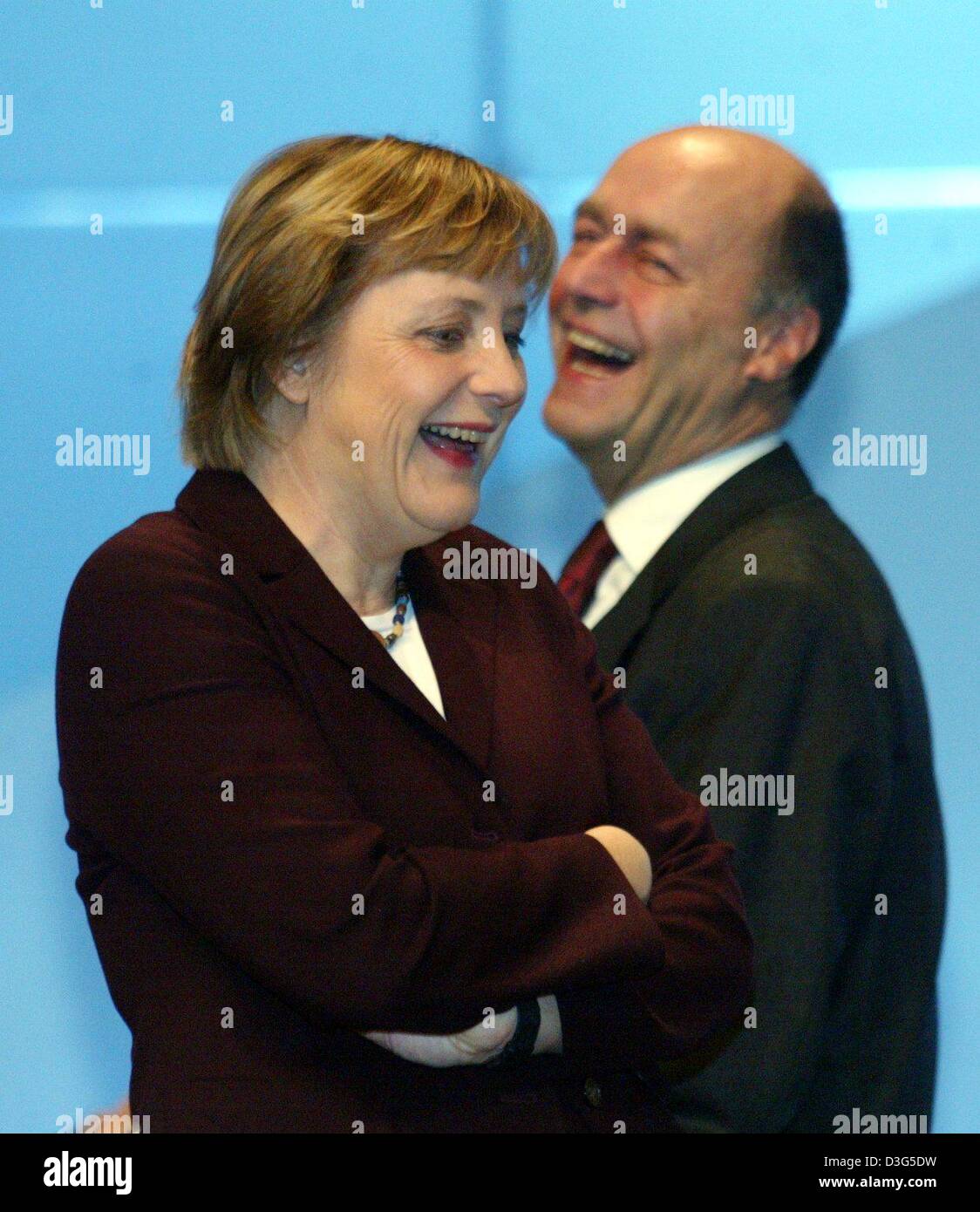 (dpa) - Angela Merkel, Chairwoman of the German opposition party CDU (Christian Democratic Union), shares a laugh with CDU General Secretary Laurenz Meyer during the party convention in Leipzig, Germany, 2 December 2003. CDU leaders were wrapping up their two-day party congress after agreeing a more radical reform of Germany's social welfare system than planned by Schroeder's lefti Stock Photo