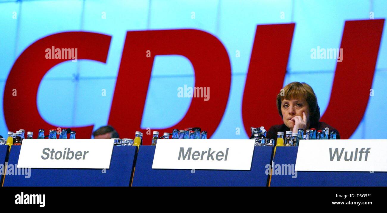 (dpa) - Angela Merkel, Chairwoman of the German opposition party CDU (Christian Democratic Union), sits on the panel during the party convention in Leipzig, Germany, 2 December 2003. CDU leaders were wrapping up their two-day party congress after agreeing a more radical reform of Germany's social welfare system than planned by Schroeder's leftist government. Stock Photo
