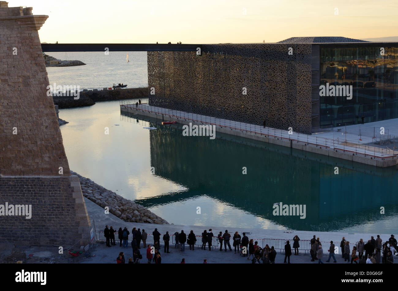 MUCEM Museum of European and Mediterranean Civilizations by Rudy Ricciotti, Reflected in Port at Dusk, Marseille Provence France Stock Photo