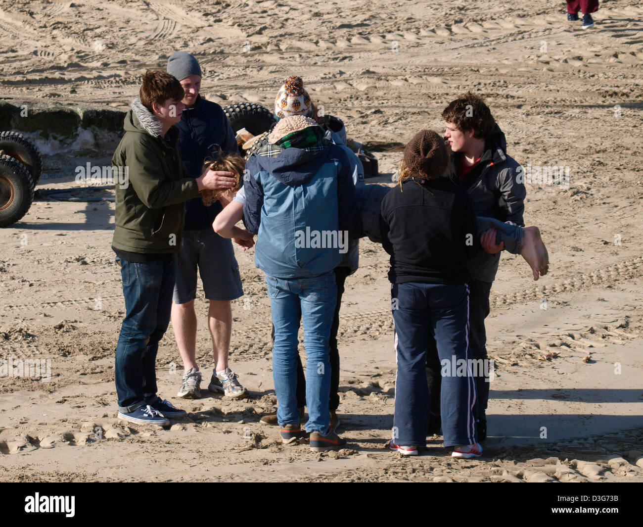 Moving a casualty, rescue training on the beach, Newquay, Cornwall, UK Stock Photo