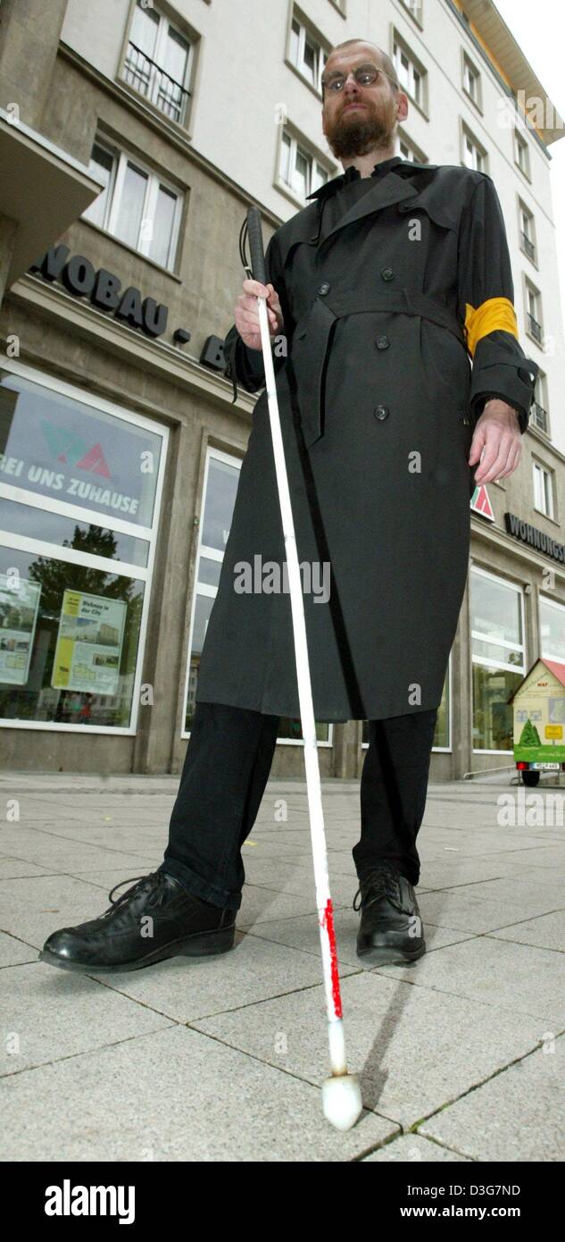 (dpa) - The visually impaired Hans-Peter Pischner walks with a blindman's stick along the pedestrian zone in downtown Magdeburg, Germany, 11 October 2003. Stock Photo