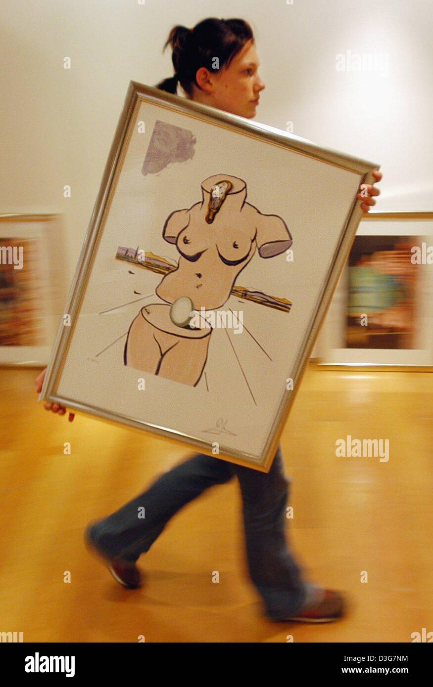 (dpa) - An employee carries the lithography 'Birth of Venus' by Spanish artist Dali to its place in the Dali exhibition in Regensburg, Germany, 3 November 2003. The exhibition with paintings, sculptures, graphics, books and films of the surrealist artist will runs through 21 December. Stock Photo