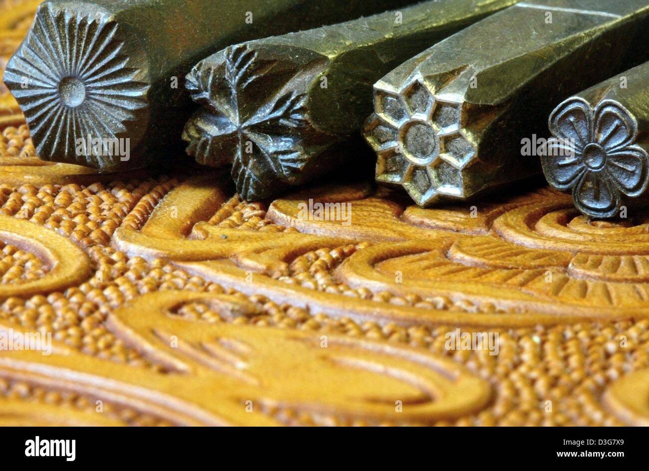 (dpa) - Punches with different patterns, which are used for embossing works are seen at the company Vanino und Henkel in Hamburg, 11 September 2003. The profession of the embosser has nearly died out and Vanino und Henkel is the oldest existing company of its kind in Germany. The company was founded in 1931 and has so far embossed the leather seats for senators and the replication  Stock Photo