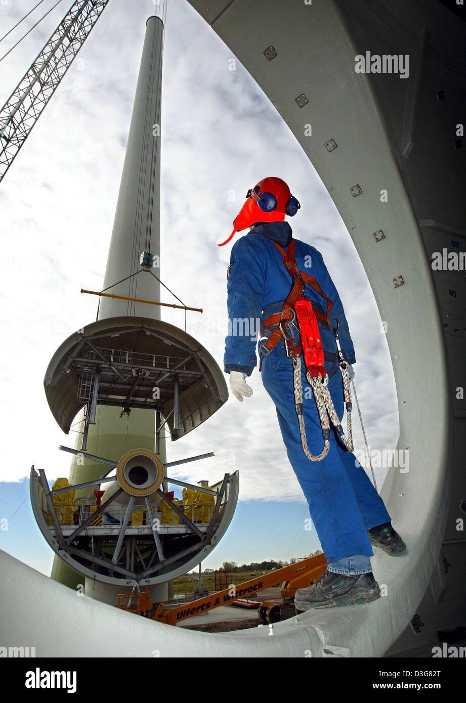 (dpa) A technician stands in the vent of a rotor blade of a E112
