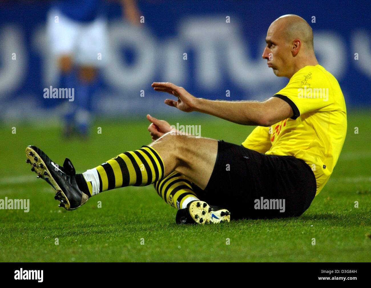 (dpa) - Dortmund's Czech forward Jan Koller sits on the pitch during the Bundesliga soccer game opposing Borussia Dortmund against VfL Bochum in Bochum, Germany, 26 October 2003. Dortmund lost the game 0-3 and slipped to fifth place in the German first division. Stock Photo